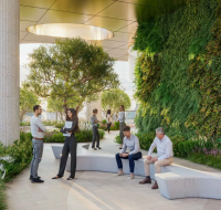 High-rise amenity deck with a swimming pool, slide, and vertical garden overlooking a major highway and city landscape.