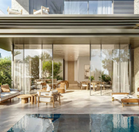 Luxury villa patio and private pool area with outdoor lounge furniture and large sliding glass doors.