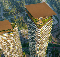 Two tall, modern skyscraper buildings illuminated at night, featuring offset balconies and a podium base.