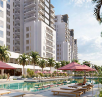 Resort-style swimming pool with sun loungers and palm trees at South Garden Tower 3 by WASL, offering modern residential living in Dubai