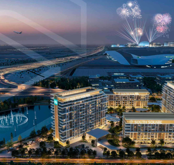Night view of residential towers with lake, highway, and fireworks in the distance