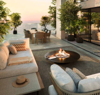 Penthouse terrace with outdoor seating and panoramic sea view