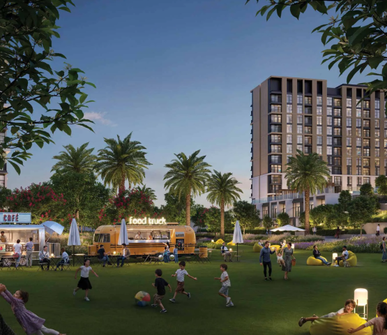 The central community park at Terra Gardens, featuring food trucks, beanbag seating, and family recreation in the evening.