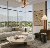 Contemporary interior design featuring abstract art, stylish furniture, and a view overlooking a pool and green community.