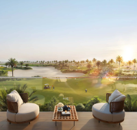 Balcony view overlooking golf course and lake with sunrise scenery