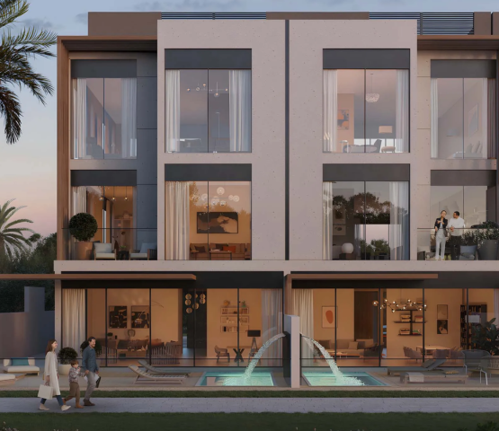 Evening view of townhouse with pool at Terra Golf Collection Phase 2