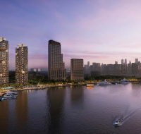 Modern gymnasium at The Edit at d3, with high-end equipment and large windows overlooking the waterfront.