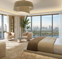 Luxury living room with double-height ceilings, a winding staircase, and vast windows overlooking the city.