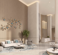 Spacious living room with floor-to-ceiling windows and natural light