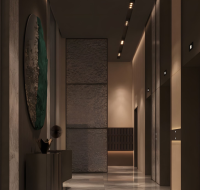 Stylish elevator lobby at V-SUITES by Anax with modern lighting and artistic decor