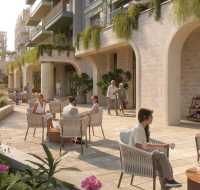 Group enjoying a candlelit dinner on a modern waterfront balcony during twilight