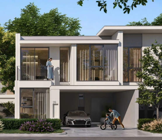 The exterior of a family townhouse in Vindera at The Valley, featuring a balcony and front garden.