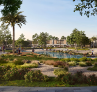 Outdoor recreational area with a central pond, playground, and people strolling through gardens.