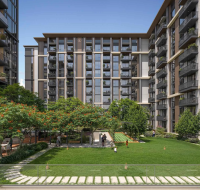 Green courtyard with lawn and seating between buildings