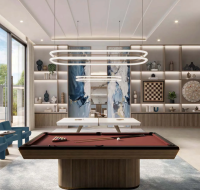 Game room with pool table, seating, and wall-mounted games